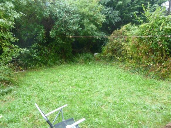 Private grassy garden surrounded by greenery...