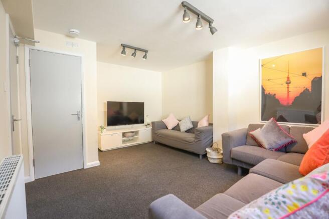 Bright and tidy living room featuring comfortab...