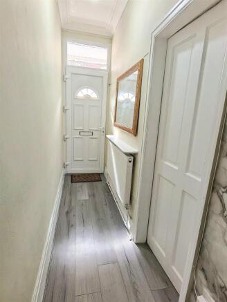 Bright hallway with modern wood-effect flooring...