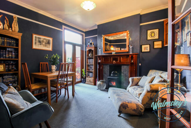Rear sitting room with French doors to garden