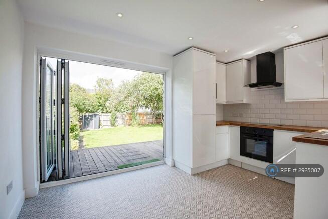 Kitchen Dining Room With Bifold Doors To Deck