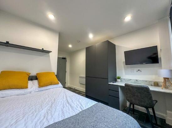 A modern double bedroom featuring a comfortable...