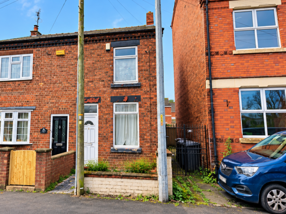 Sunny Red-Brick Terraced Street with Telegraph ...