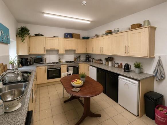 Spacious kitchen with ample storage and dining...