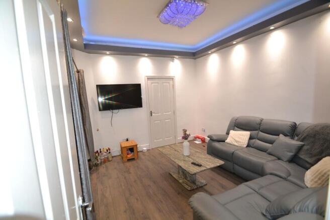 Contemporary living room with plush grey reclin...