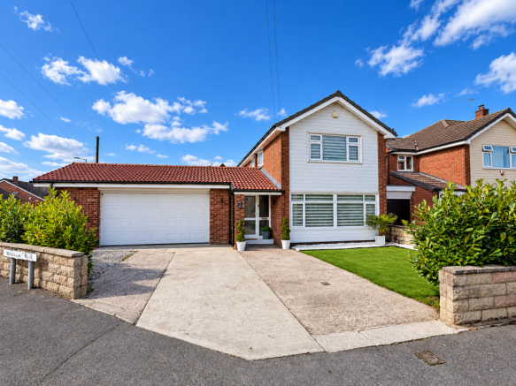 Sunny Suburban Home with WAVANA RISE Sign.png