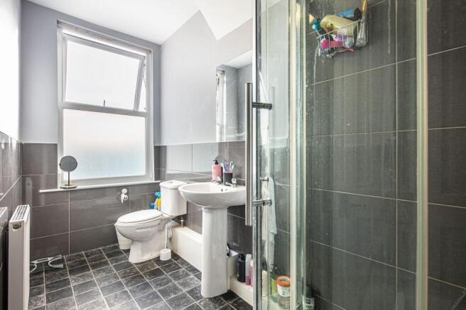 Bright, contemporary bathroom with a large fros...