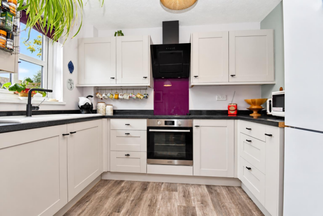 Bright Modern Kitchen with Purple Splashback.png