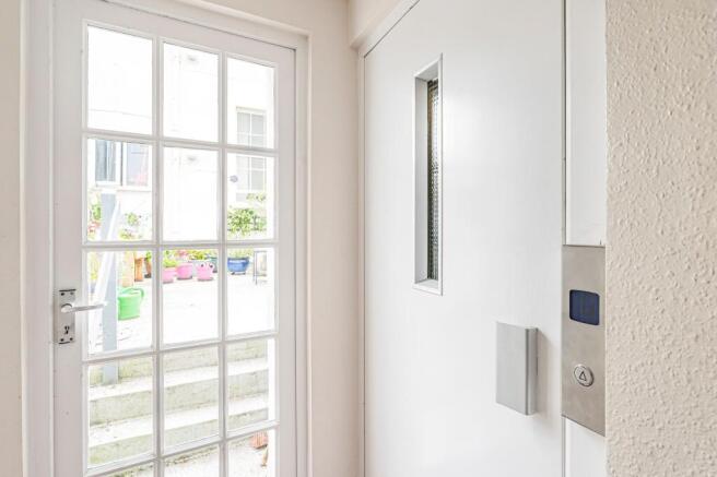 Door to lift and communal garden