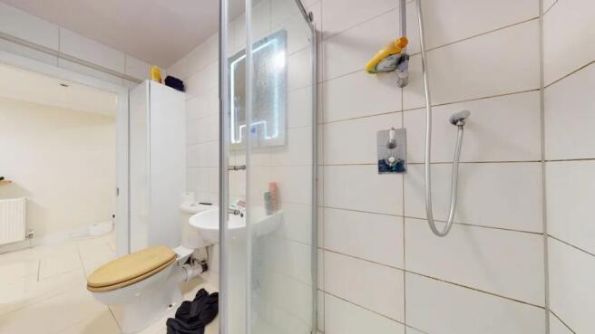 Bright and functional bathroom featuring a tile...