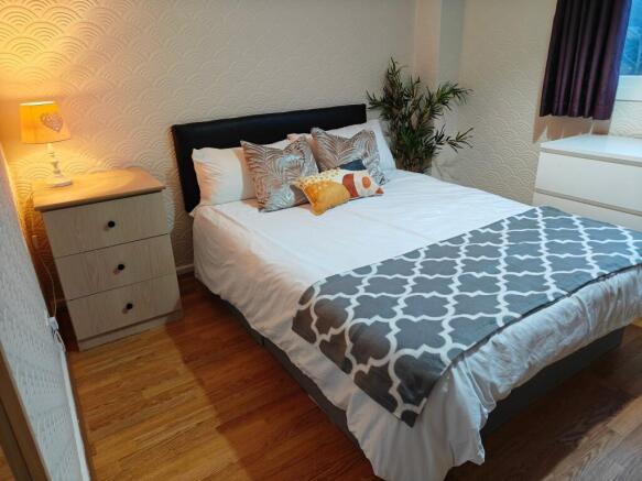Bright, neatly styled double bedroom...