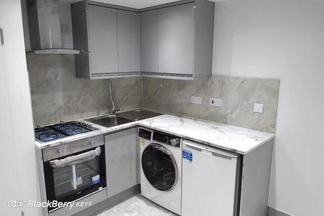 Modern fitted kitchen with built-in appliances...