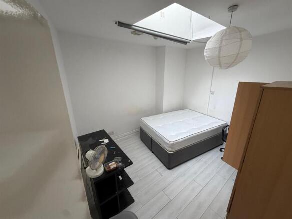 Bright double bedroom with skylight and storage...