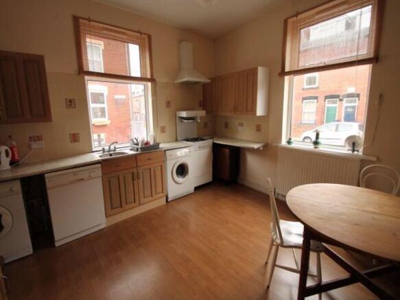 Bright, well-equipped kitchen with large window...