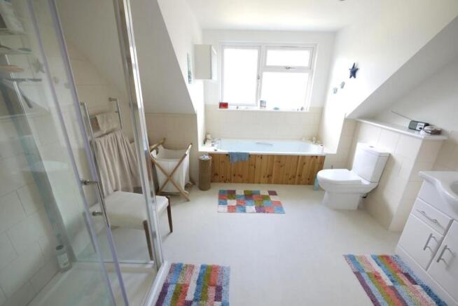 SPACIOUS BATHROOM:-