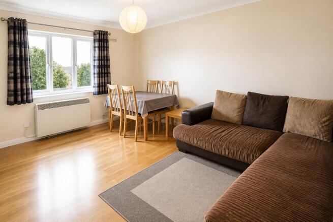 Spacious and bright living area with dining spa...