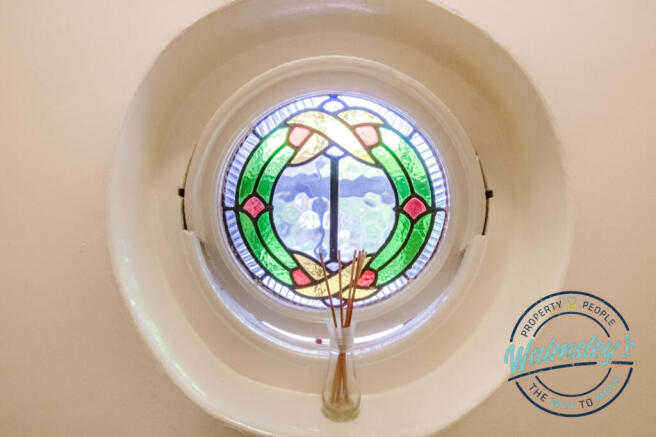 Stained glass porthole window feature