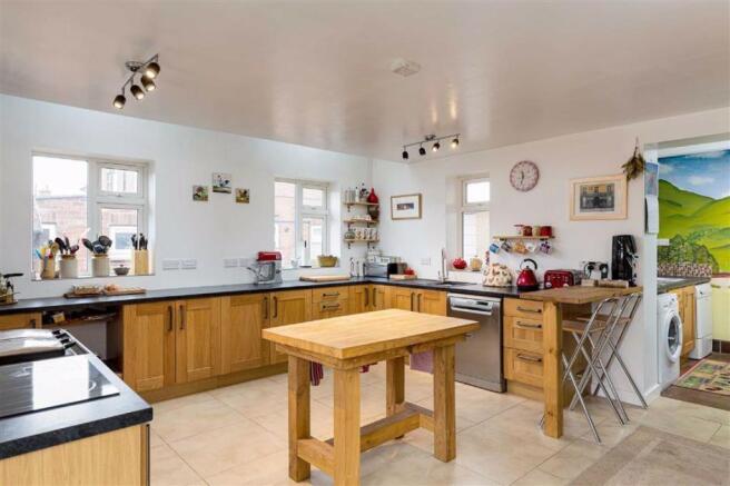 UTILITY OPEN TO KITCHEN / DINING ROOM
