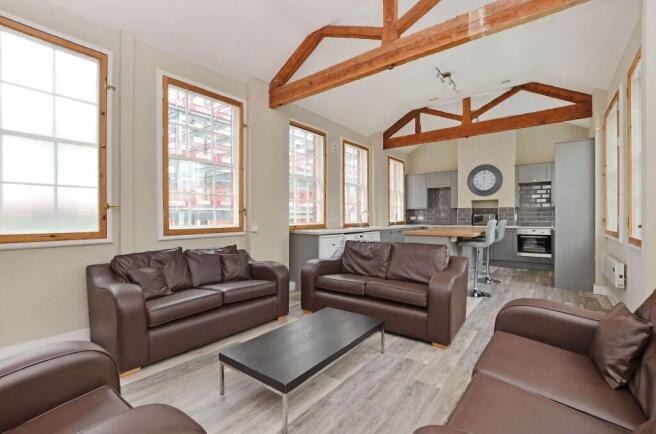 Bright and spacious living room with multiple l...