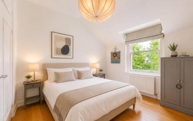 bedroom two dressed as a double overlooking commun