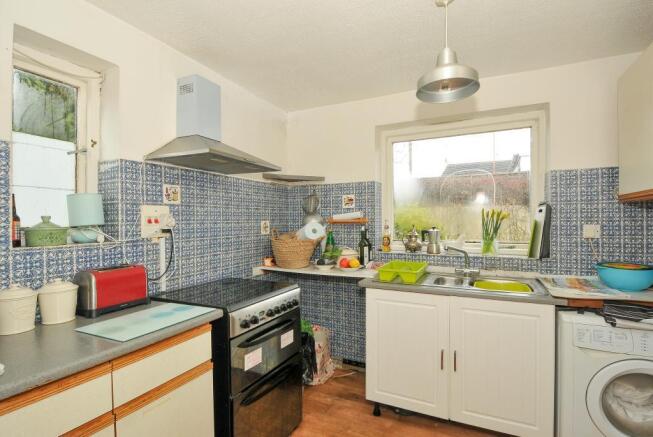 Fitted kitchen with breakfast area