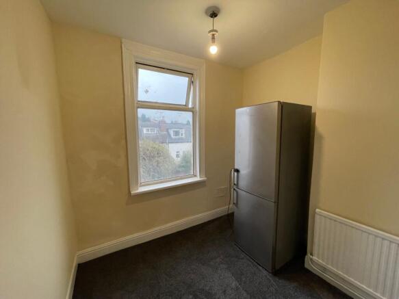 Bright kitchen area with modern fridge freezer...
