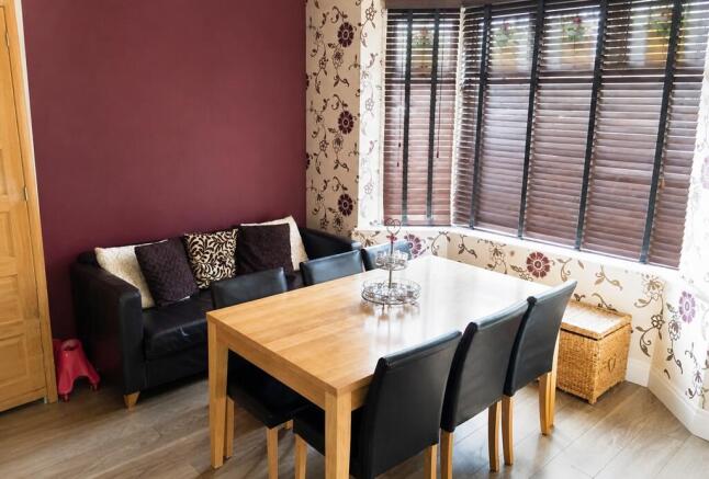 Cozy living room with a dining table and sofa...