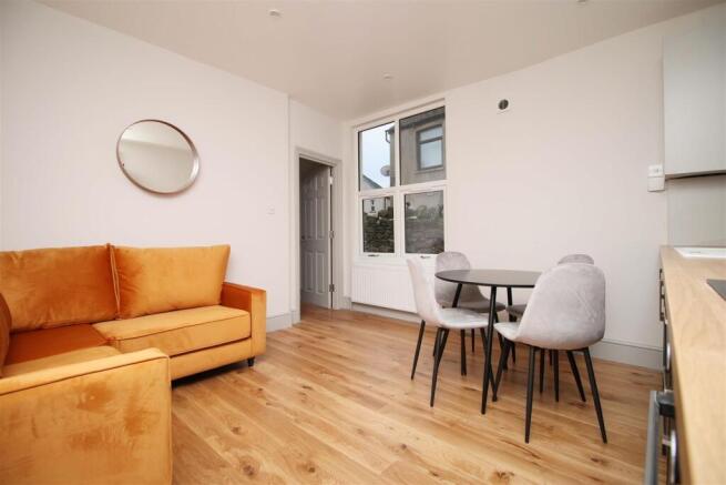 Bright modern living area with stylish sofa...