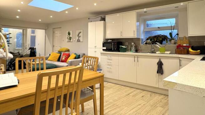 Bright open-plan living space with a modern fit...