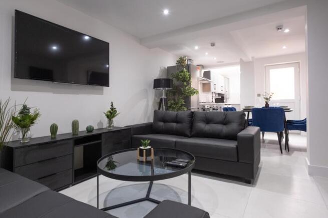 A stylish and spacious modern living room with ...