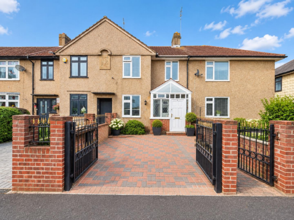 Elegant Terraced Home with Open Gates.png