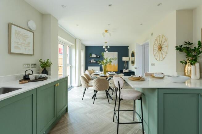 The kitchen flows seamlessly into the living spaces