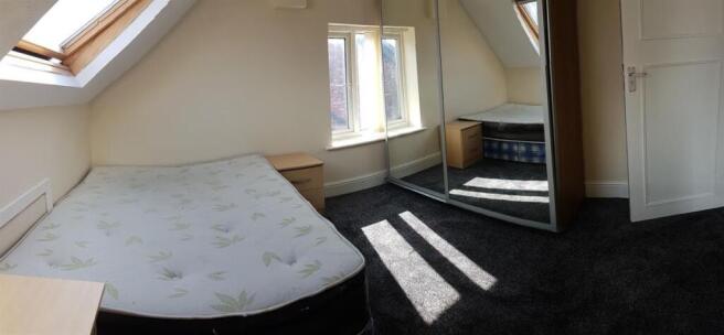 Bright loft double bedroom with desk and wardro...