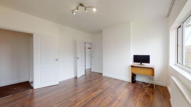Bright and spacious room with stylish wood floo...