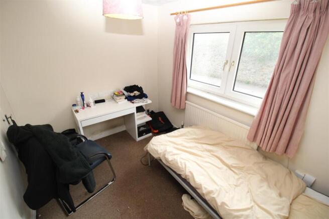 Bright bedroom with desk and natural light...