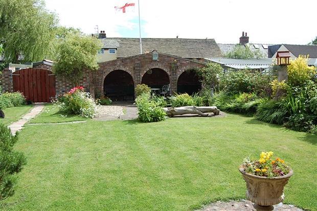 front garden & covered sitting area
