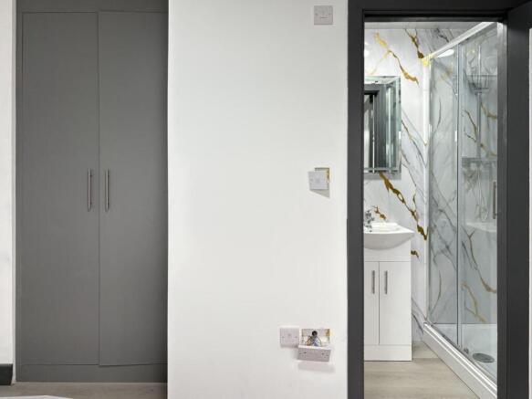 Bright, modern hallway with built-in storage an...