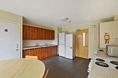 Bright kitchen with ample storage and appliance...