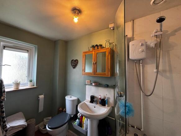 Bright bathroom with modern walk-in shower...