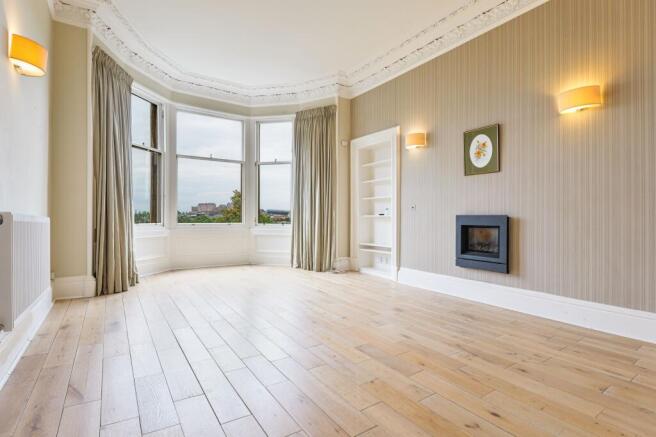 Lounge view with windows overlooking the Meadows with Castle views