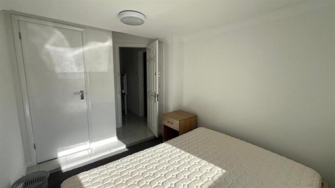 Bright, tidy bedroom with built-in storage...