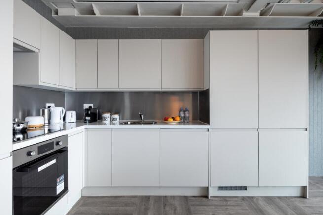 Sleek modern kitchen with integrated appliances...