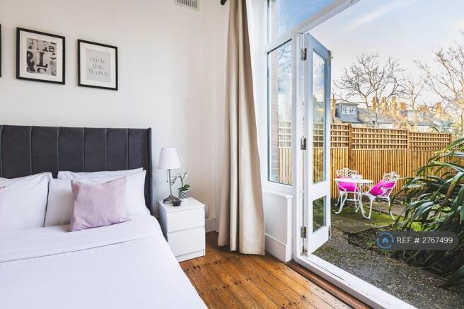 Bedroom With Doors Opening Into Private Garden