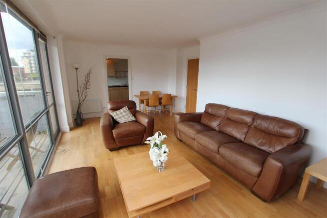 Bright, open living space with leather seating...