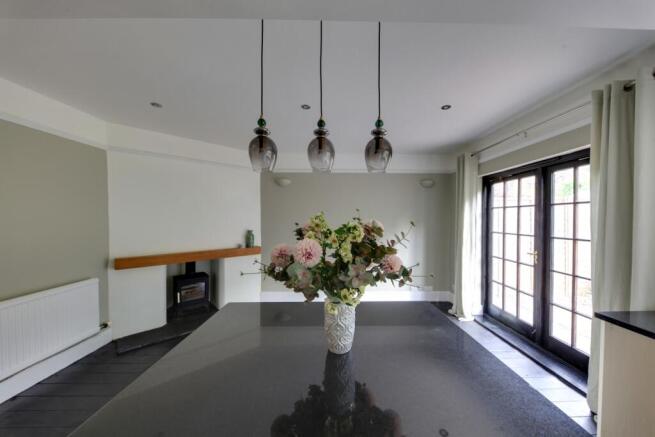 view to dining area and log burner