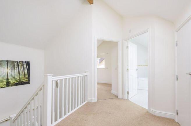 Landing with storage cupboards