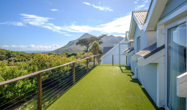Upstairs balcony with views, access from main and 2nd bedroom.