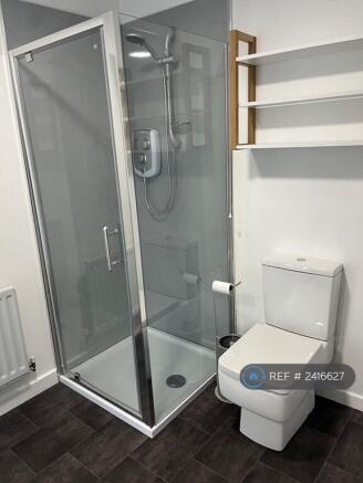 Shower And Toilet In Bathroom