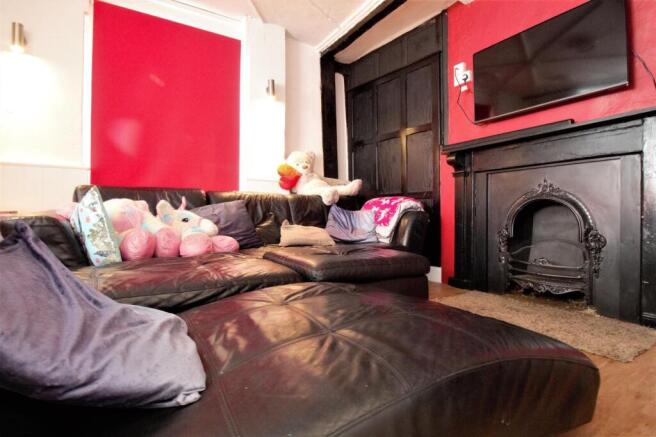 Cozy lounge with leather seating and decorative...