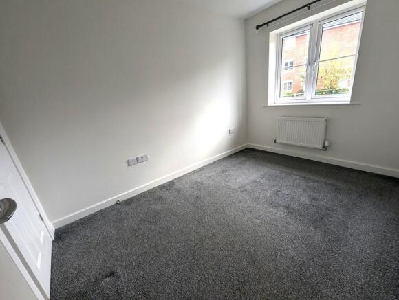 BEDROOM ONE. REAR...